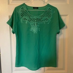 Green short sleeve top with cut out detail. Size M.